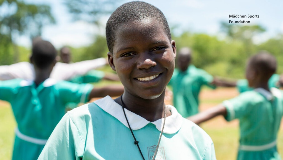 Smiling girl at a Mädchen Sports Foundation sports activity